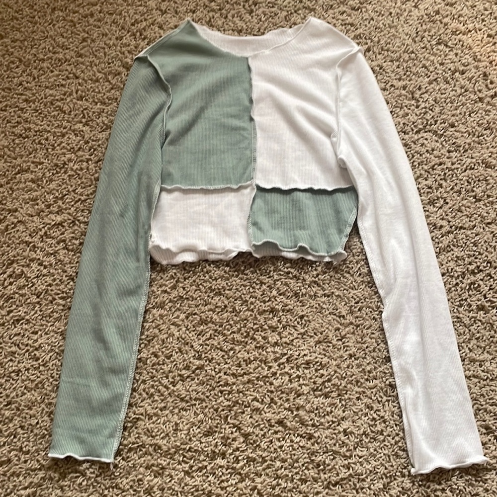 This is a sea green and white cropped long sleeve shirt. Super cute!